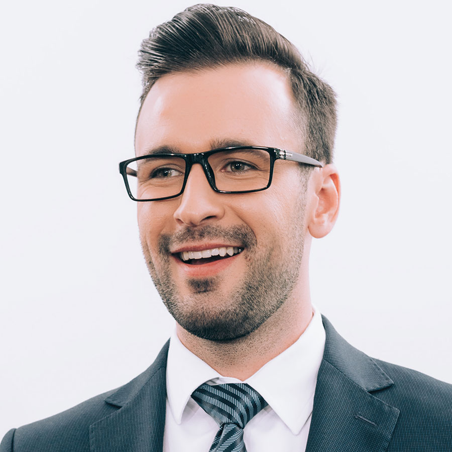 smiling handsome speaker in glasses talking and ge DXCYQ7D